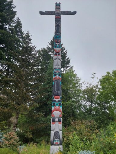 totem pole in oregon with greenery